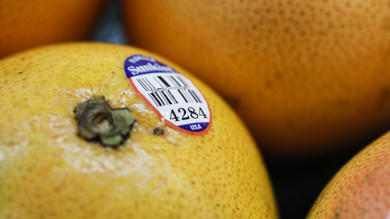 Fruit sticker on an orange