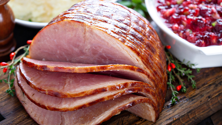 Holiday Ham sliced on wooden platter