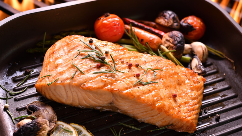 A salmon fillet in a grill pan