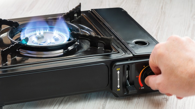 Turning on a portable burner