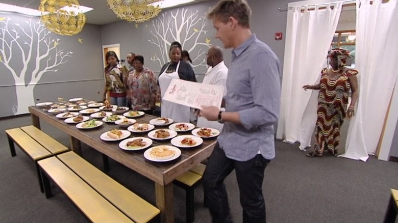 Gordon Ramsay explaining new menu items to Ms. Jean's Southern Cuisine staff.