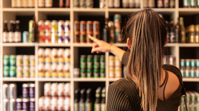 Woman buying beer