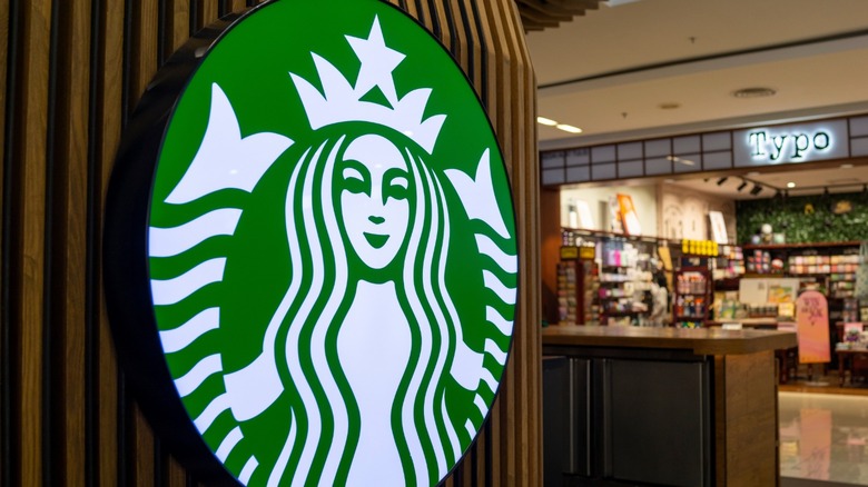 Starbucks sign with store in the background