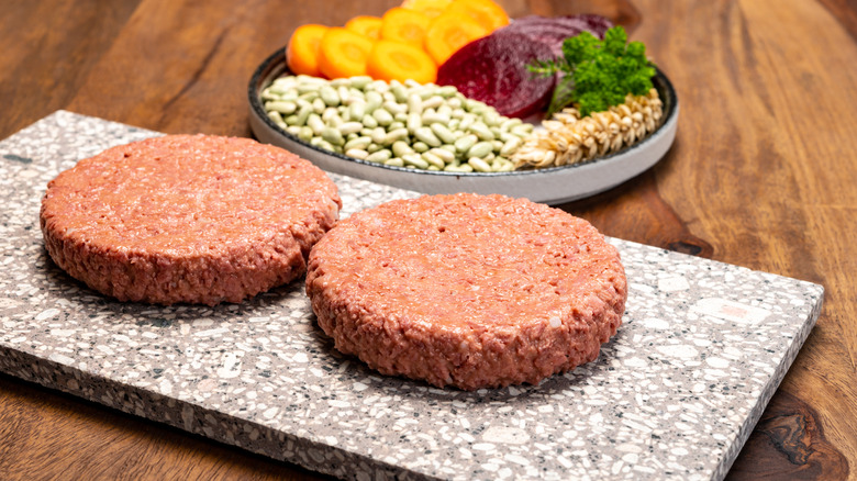 Vegan patties on a gray board