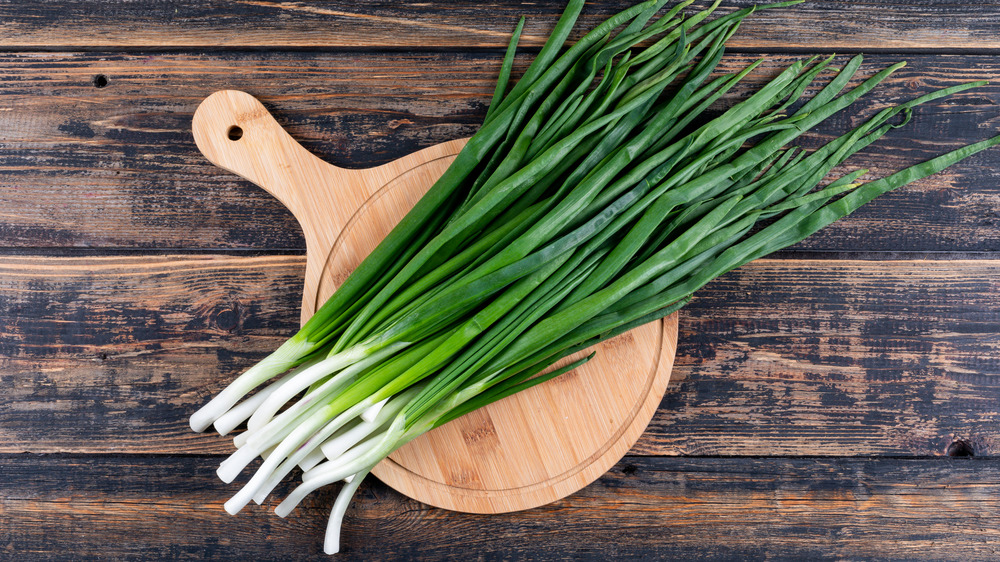 Scallions on cutting board