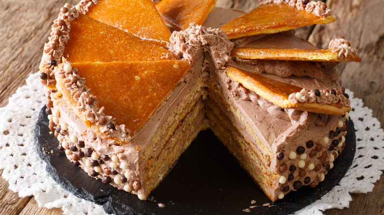 sliced dobos torte on plate