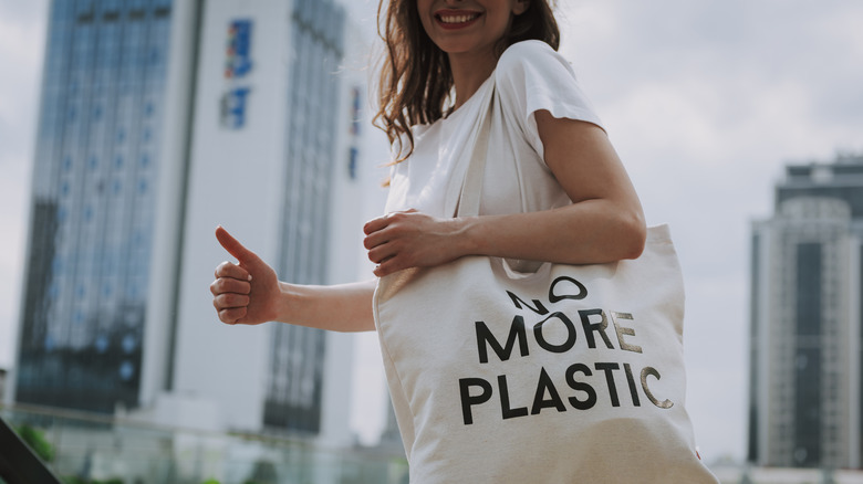 Person toting reusable bag