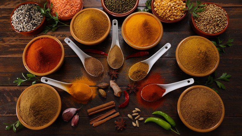 Colorful spices in ceramic bowls 