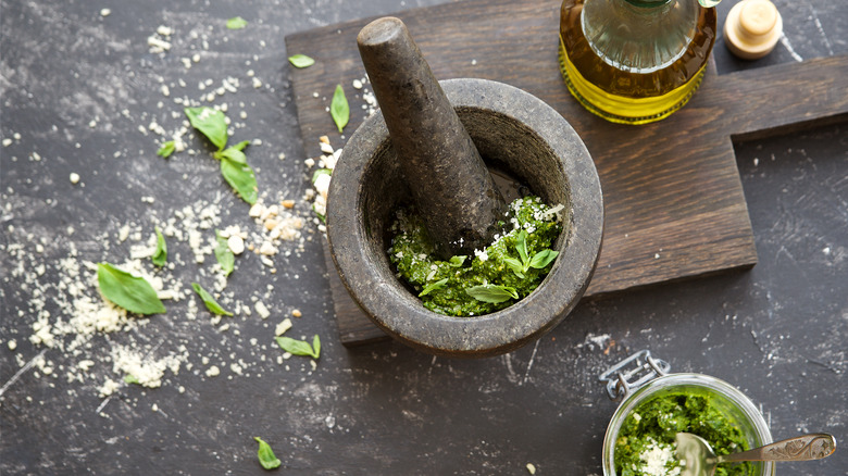 mortar and pestle with pesto