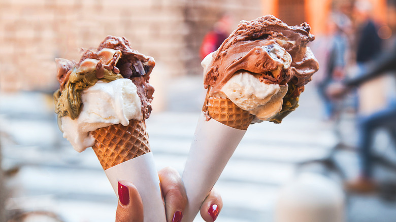 Hand holding two gelato cones