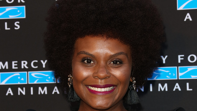 Tabitha Brown smiling, with an afro