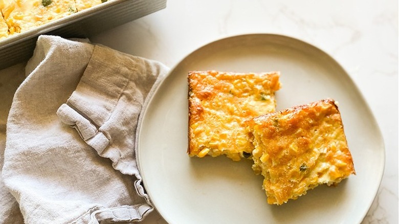 Slices of cornbread cake on round plate. 