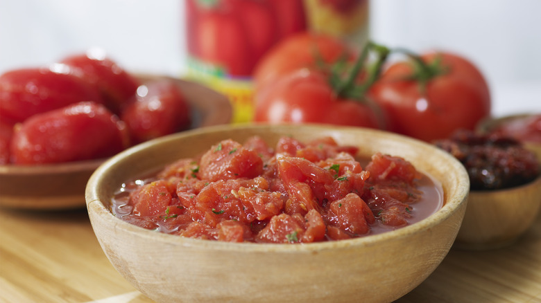 Canned tomatoes in white bowl