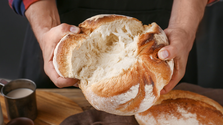 Hands holding bread