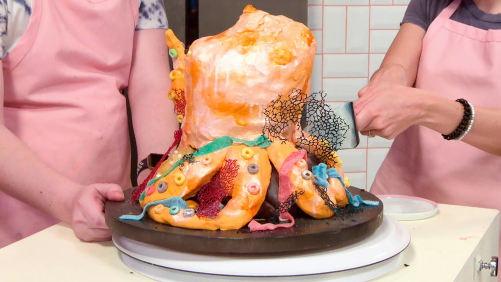 Bakers work on octopus Nailed It! creation