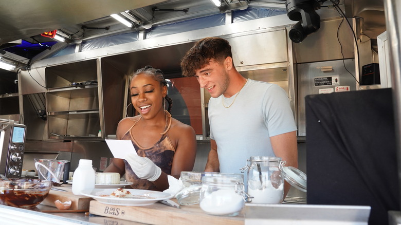 Couple cooking together on Hulu's Hotties
