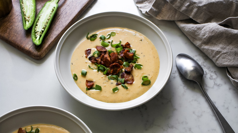 jalapeno beer cheese soup with green onions and bacon