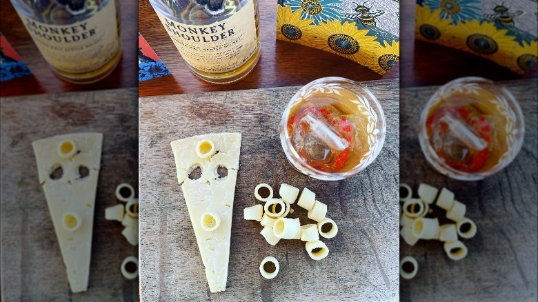 Whiskey with cheddar cheese slice and Hula Hoops