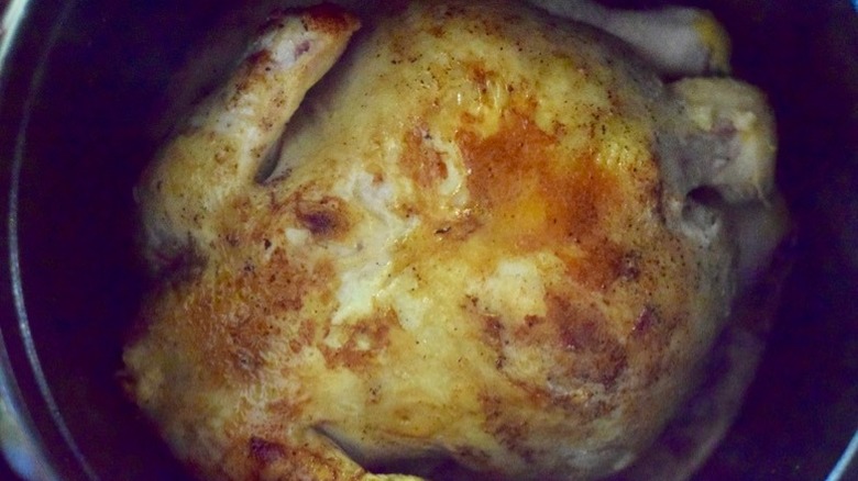 chicken browning in butter over hot stovetop