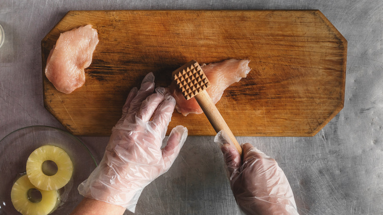 Chef tenderizes meat