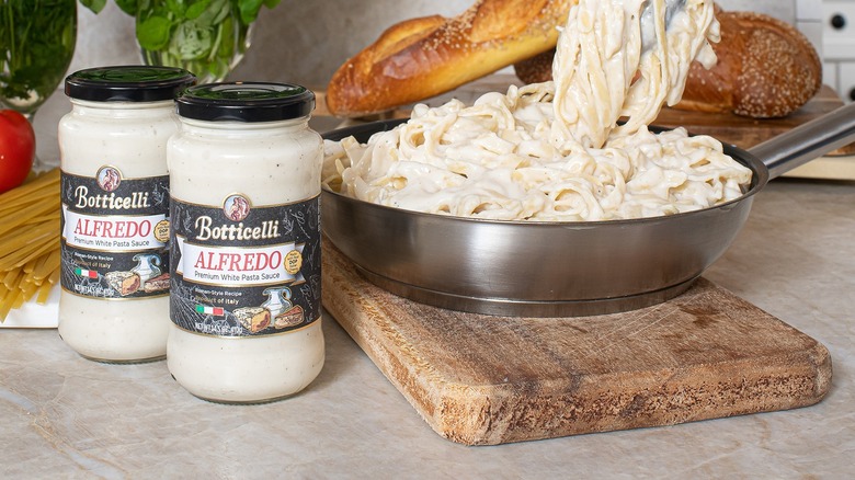 Alfredo sauce jars on counter