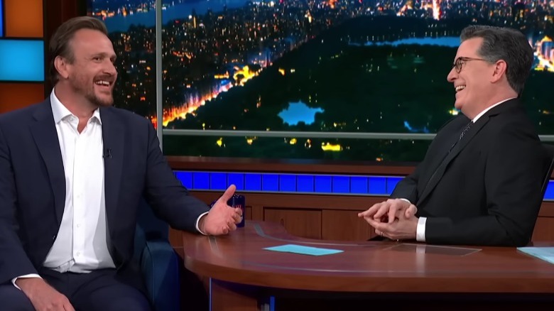 Actor Jason Segel laughing with Stephen Colbert on "The Tonight Show"