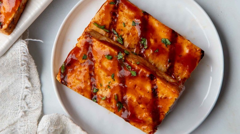 grilled bbq tofu slices on white plate