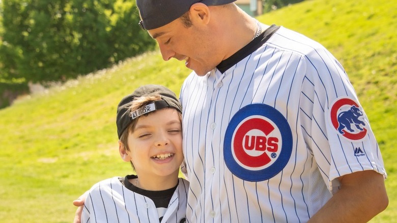 Jeff Mauro with son in Cubs jerseys