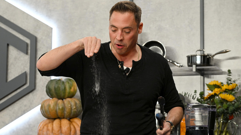 Jeff Mauro sprinkling salt