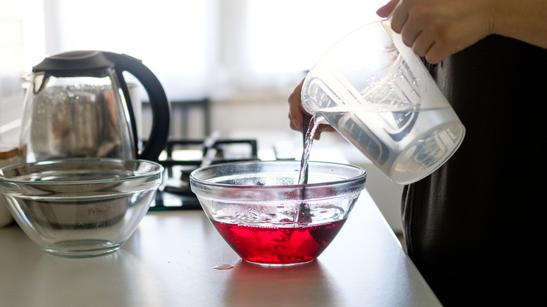 dissolving Jell-O in bowl