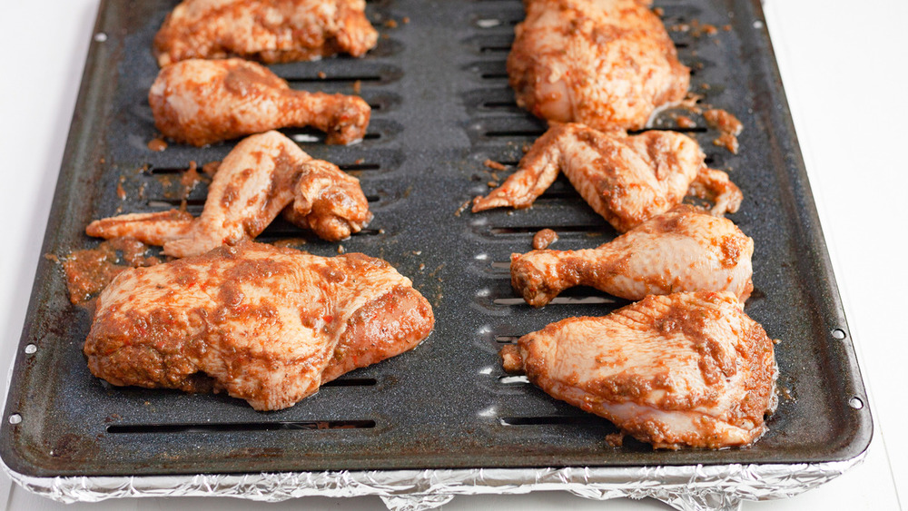 Chicken pieces on the baking sheet