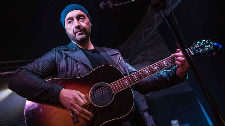 Joe Bastianich onstage playing guitar