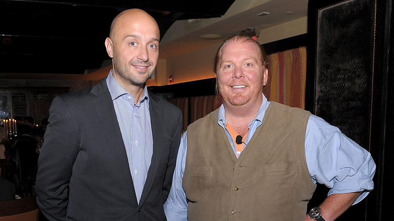 Joe Bastianich and Mario Batali smiling together 