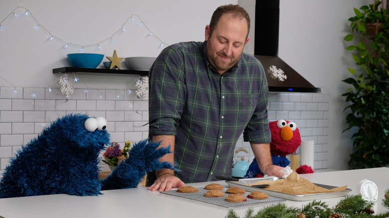 Joel Gamoran with Cookie Monster and Elmo