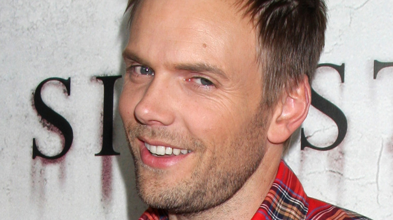 Joel McHale smirking 