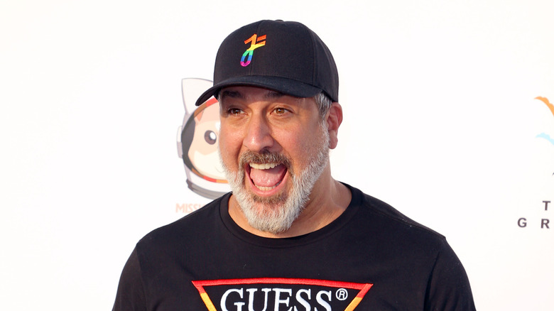 Joey Fatone in colorful outfit on red carpet