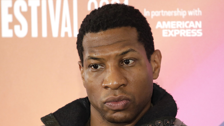 Jonathan Majors pursing lips