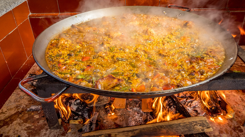 Cooking paella over fire