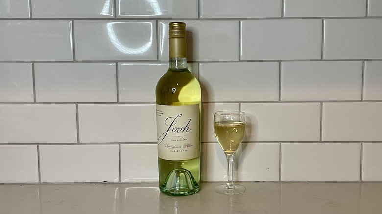 white wine bottle and glass