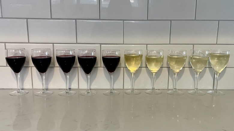 glasses of wine lined from darkest to lightest