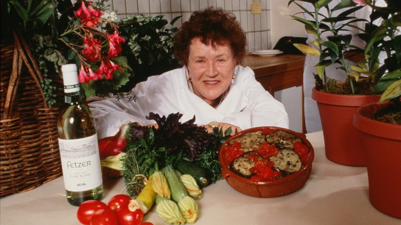 Julia Child posing with foods