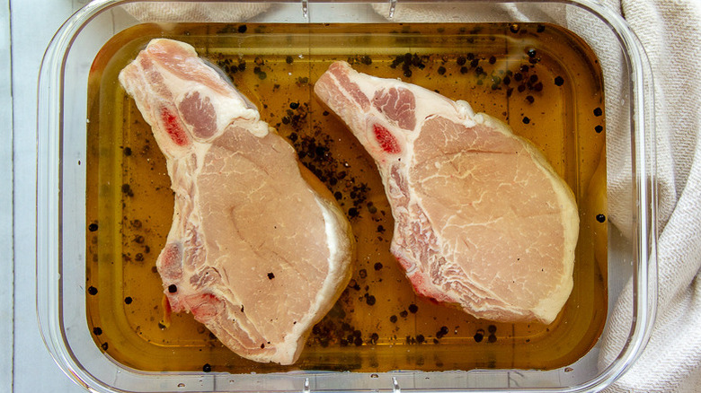 pork chops submerged in brine