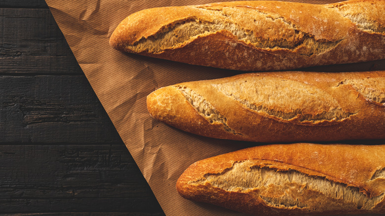 Three French baguettes on paper