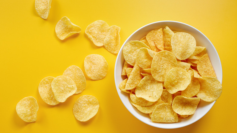 potato chips on yellow background