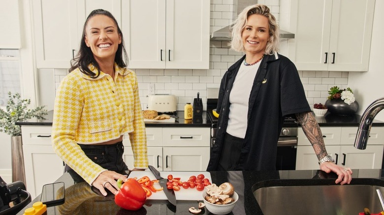 Ashlyn Harris and Ali Krieger in kitchen