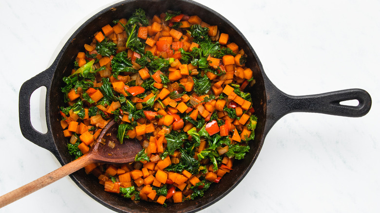 Vegetables frying in skillet