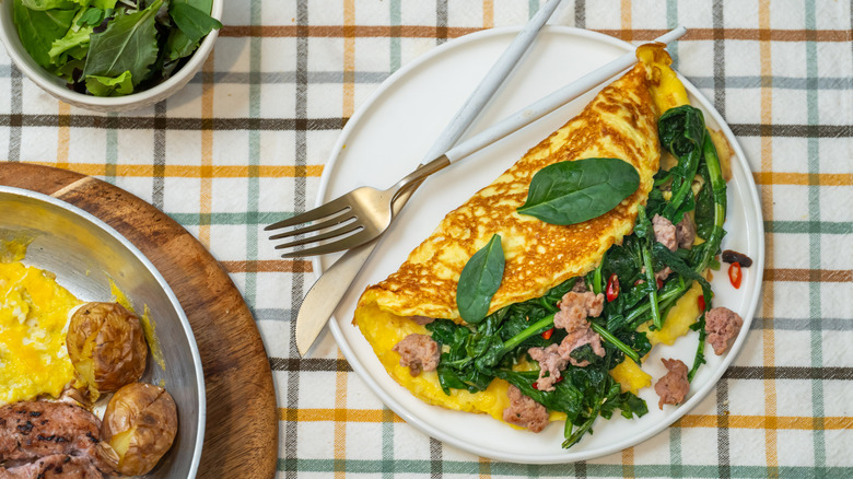 Spinach and sausage omelet on plate