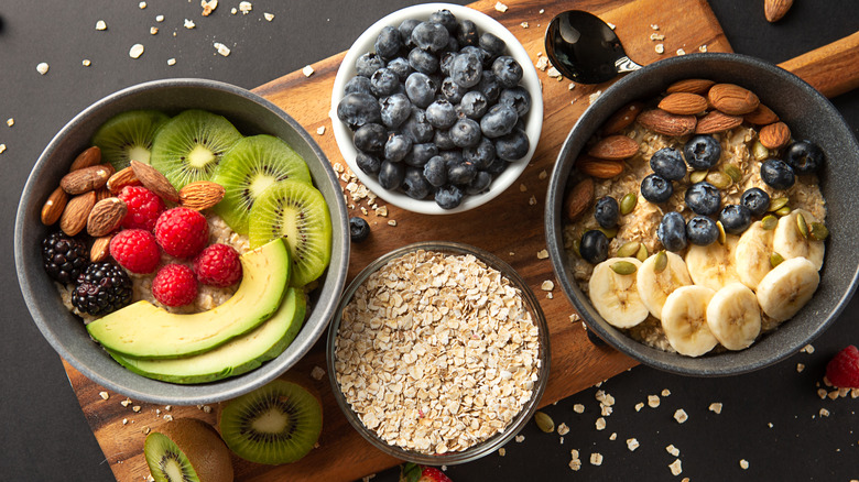 Two bowls of oatmeal with fruit