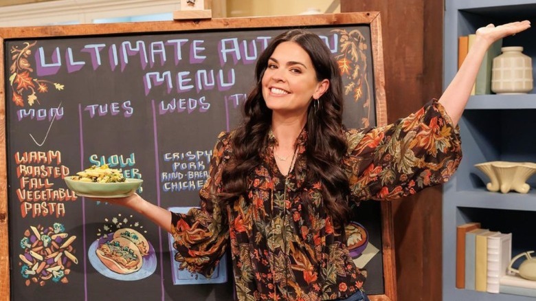 Katie Lee Biegel holding plate of food