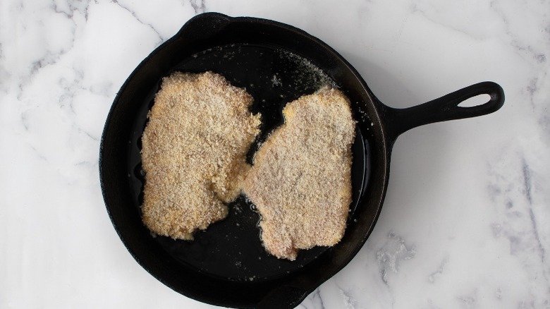 frying pork cutlets in skillet